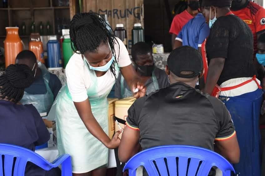 Foundation health worker providing medical services to a community member during an outreach event